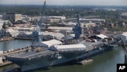 In this April 27, 2016 photo, USS Gerald R. Ford is stationed at Newport News Shipbuilding in Newport News, Va. The $12.9 billion warship is the first of the Navy’s next generation of aircraft carriers.