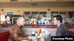 Bruce Willis and Joseph Gordon-Levitt as &quot;Joe&quot; in TriStar Pictures, Film District, and End Game Entertainment&#39;s action thriller LOOPER.