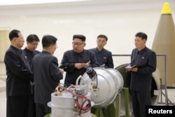 FILE - North Korean leader Kim Jong Un, center, is said to provide guidance on nuclear weapons development in this undated photo released by North Korea's Korean Central News Agency in Pyongyang, Sept. 3, 2017.