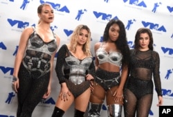 Dinah Jane, from left, Ally Brooke, Normani Kordei, and Lauren Jauregui of Fifth Harmony, winners of the award for best pop video for &quot;Down,&quot; pose in the press room at the MTV Video Music Awards.