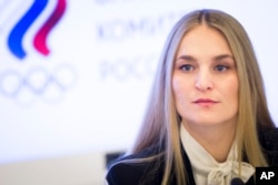 Russian fencer Sofiya Velikaya attends a news conference in Moscow, Russia, Dec. 12, 2017.