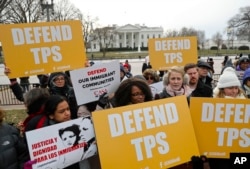 FILE - CASA de Maryland, an immigration advocacy and assistance organization, holds a rally in Lafayette Park, across from the White House in Washington.