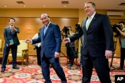 U.S. Secretary of State Mike Pompeo, right, meets with Vietnamese Prime Minister Nguyen Xuan Phuc at the International Convention Center in Hanoi, Vietnam, July 9, 2018.