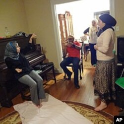 Students discuss issues relating to Muslim Americans with prominent speakers at the house of the Muslim Public Service Network in Washington, D.C.