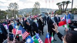 In this photo released by the Taiwan Presidential Office, Taiwan Vice President William Lai waves to supporters during a stopover in Los Angeles, Jan. 25, 2022. Lai is leading a Taiwanese delegation to Honduras for the inauguration of President-elect Xiomara Castro Jan. 27-28.