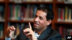 Rasheed Alnozili, publisher of The Yemeni American News, is interviewed in Dearborn, Michigan, Jan. 9, 2018. People from Yemen have recently begun to see long-term futures in the U.S. and are making their culture part of their businesses.