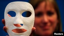 Vanessa Palsenbarg, Corporate Communications Specialist at Materialise, shows a 3D model called Burn Mask, a customized mask for facial scar management at the company's headquarters in Leuven, January 24, 2013.