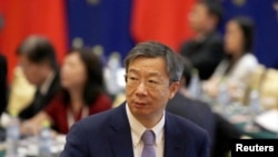 China's central bank governor Yi Gang arrives for the EU-China High-level Economic Dialogue at Diaoyutai State Guesthouse in Beijing, June 25, 2018.