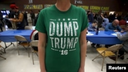 FILE - A voter wears a "Dump Trump '16" shirt at a Democratic caucus in Salt Lake City, Utah, March 22, 2016. A poll has found that a Sanders presidential nomination would be better for the Democratic Party than a Trump candidacy would be for the GOP.