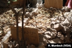 The body of a man buried in this Old Mosul garden after he was shot dead by IS for smoking, June 25, 2017.