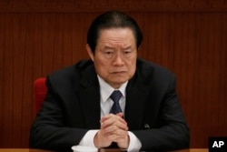 FILE - Zhou Yongkang, then Chinese Communist Party Politburo Standing Committee member in charge of security, attends a plenary session of the National People's Congress at the Great Hall of the People in Beijing.