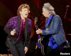 British veteran rockers The Rolling Stones lead singer Mick Jagger sings next to band member Keith Richards, as they open their North American "Zip Code" tour in San Diego, California, May 24, 2015.