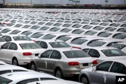 FILE - Volkswagen Jettas produced in Mexico for export are parked at the port terminal in the Gulf city of Veracruz, Mexico.