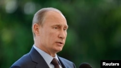 Russian President Vladimir Putin speaks at a news conference at the presidential summer residence Kultaranta in Naantali, June 25, 2013.