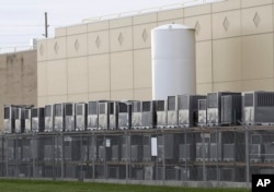 Air conditioning units are stacked outside the Carrier Corp. plant, in Indianapolis, Nov. 30, 2016.