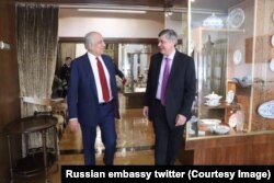 FILE - Afghan-born special reconciliation representative Zalmay Khalilzad meets with Russian envoy Zamir Kabulov in the Russian embassy in Ankara, Turkey.