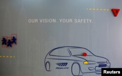 FILE - Signage is seen at the offices of Israeli driving assistant software maker Mobileye NV in Jerusalem, Sept. 14, 2016.