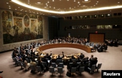 FILE - The United Nations Security Council votes to approve a resolution at the U.N. headquarters in New York.
