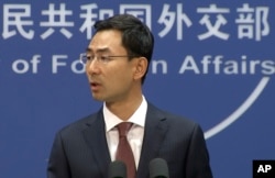FILE - In this image made from video, Chinese Foreign Ministry spokesperson Geng Shuang speaks during a press briefing in Beijing, July 11, 2017.