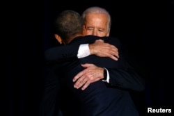 FILE - U.S. President Barack Obama is joined onstage by Vice President Joe Biden after his farewell address in Chicago, Jan. 10, 2017.