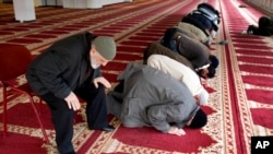 FILE - Muslim worshippers pray in the prayer hall of the Polder Mosque in Amsterdam, Netherlands, Feb. 18, 2010.