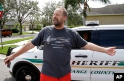 FILE - Eric Paddock, brother of Las Vegas gunman Stephen Paddock, speaks to members of the media near his home, Oct. 2, 2017, in Orlando, Fla.