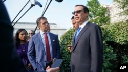 Treasury Secretary Steven Mnuchin speaks to members of the media at the White House in Washington, July 26, 2018.