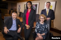FILE - From left, Daniel Maury, Lanaya Irvin, Jennifer MacDonald and Matt Koehler, pictured in New York, April 13, 2015, were among LGBT activists in finance who helped persuade several Wall Street firms to sign a brief on behalf of businesses that back gay marriage.