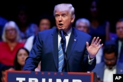 FILE - Republican presidential candidate Donald Trump speaks during a campaign rally at Merrill Auditorium in Portland, Maine, Aug. 4, 2016.