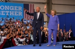 FILE - Democratic presidential candidate Hillary Clinton and Vice President Joe Biden campaign together during an event in Scranton, Pa., Aug. 15, 2016.