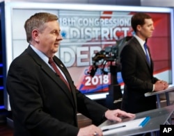 Republican Rick Saccone, left, and Democrat Connor Lamb before the taping of their first debate in the special election in the Pa., 18th Congressional District at the KDKA TV studios, Feb. 19, 2018, in Pittsburgh.
