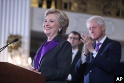 Former President Bill Clinton applauds as his wife, Democratic presidential candidate Hillary Clinton speaks in New York, Nov. 9, 2016.