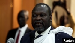 FILE - South Sudan's opposition leader Riek Machar speaks during a briefing.