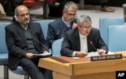 Iranian Ambassador to the United Nations Gholamali Khoshroo, front, speaks during a Security Council meeting on the situation in Iran, Jan. 5, 2018, at United Nations headquarters in New York.