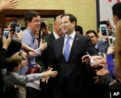 FILE - Republican presidential candidate, Sen. Marco Rubio, R-Fla., is welcomed at a rally in Houston, Texas, Feb. 24, 2016.