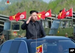 This image, from a news bulletin by North Korea's KRT, April 26, 2017, shows leader Kim Jong Un at a "Combined Fire Demonstration" held to celebrate the 85th anniversary of the North Korean army, in Wonsan, North Korea.