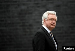 FILE - Then-Britain's Secretary of State for Exiting the European David Davis leaves 10 Downing Street, London, Jan. 29, 2018.
