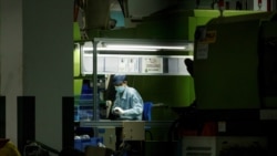 A man works at a manufacturing plant of Universal Electronics Inc. in Qinzhou in Guangxi Autonomous Region, China, April 12, 2021.