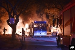 FILE - Firefighters work at a scene of an explosion in Ankara, Feb. 17, 2016. The deadly blast is expected to further cripple Turkey's tourism industry.