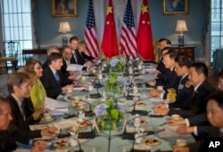 Deputy Sec. of State Antony J. Blinken, left, with China's State Councilor Yang Jiechi, right, and members of the US and Chinese delegations during a meeting at the 7th US China Strategic and Economic Dialogue (S&ED) and 6th Consultation on People-to-Peo