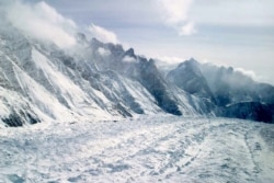 FILE - This Feb. 1, 2005 file photo shows an aerial view of the Siachen Glacier, which traverses the Himalayan region dividing India and Pakistan, about 750 kilometers (469 miles) northwest of Jammu, India. (AP Photo/Channi Anand, File)