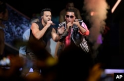 Singers Luis Fonsi, left and Daddy Yankee perform during the Latin Billboard Awards, April 27, 2017 in Coral Gables, Fla.