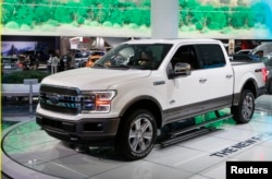 FILE - A 2018 Ford F-150 "King Ranch" pickup truck is displayed during the North American International Auto Show in Detroit, Mich., Jan. 10, 2017.