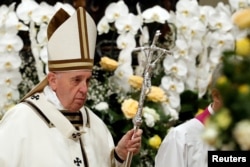 Pope Francis leaves after leading the Easter vigil Mass in Saint Peter's Basilica at the Vatican, April 20, 2019.