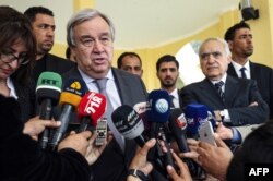 United Nations Secretary-General Antonio Guterres, left, speaks to the press before departing from Benina International Airport in Libya's eastern city of Benghazi, April 5, 2019.