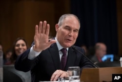 Environmental Protection Agency Administrator-designate, Oklahoma Attorney General Scott Pruitt testifies on Capitol Hill in Washington, Jan. 18, 2017, at his confirmation hearing before the Senate Environment and Public Works Committee.