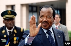 FILE - Cameroon's President Paul Biya waves as he arrives at an EU-Africa summit on April 3, 2014, at EU Headquarters in Brussels.