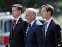 FILE - (L-R) White House Staff Secretary Rob Porter, White House Chief of Staff John Kelly, and White House senior adviser Jared Kushner walk to Marine One on the South Lawn of the White House in Washington,Aug. 4, 2017.