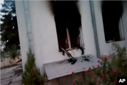 Associated Press video footage of the burned-out hospital compound in the east of Kunduz city allegedly shows automatic weapons on windowsills.