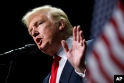 FILE - President-elect Donald Trump holds stock in the company building the disputed Dakota Access oil pipeline, and pipeline opponents warn that Trump’s investments could undercut any decision he makes on the $3.8 billion project as president.